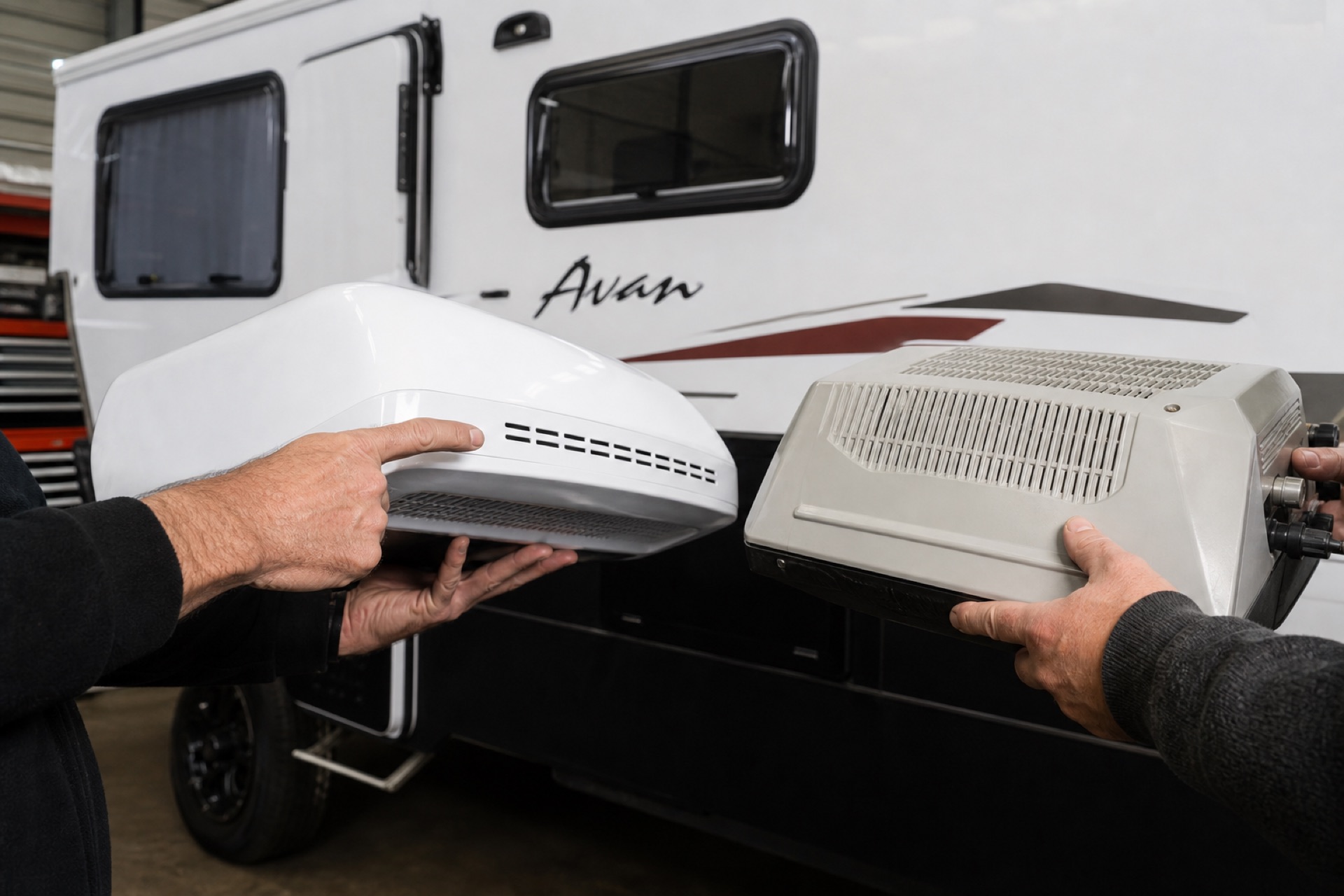Technician reviewing caravan air conditioning with tablet