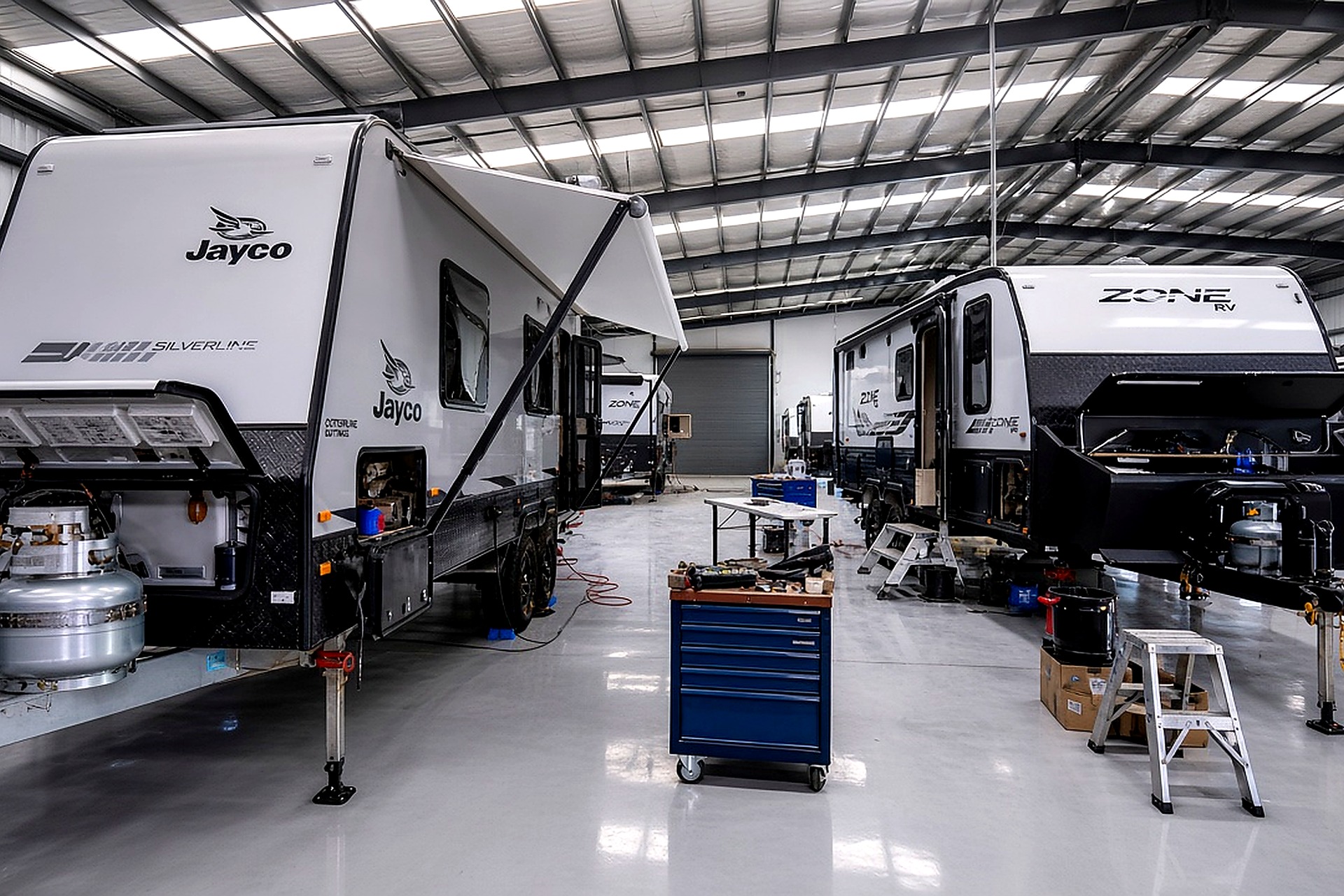 Caravans in workshop for appliance installation and servicing