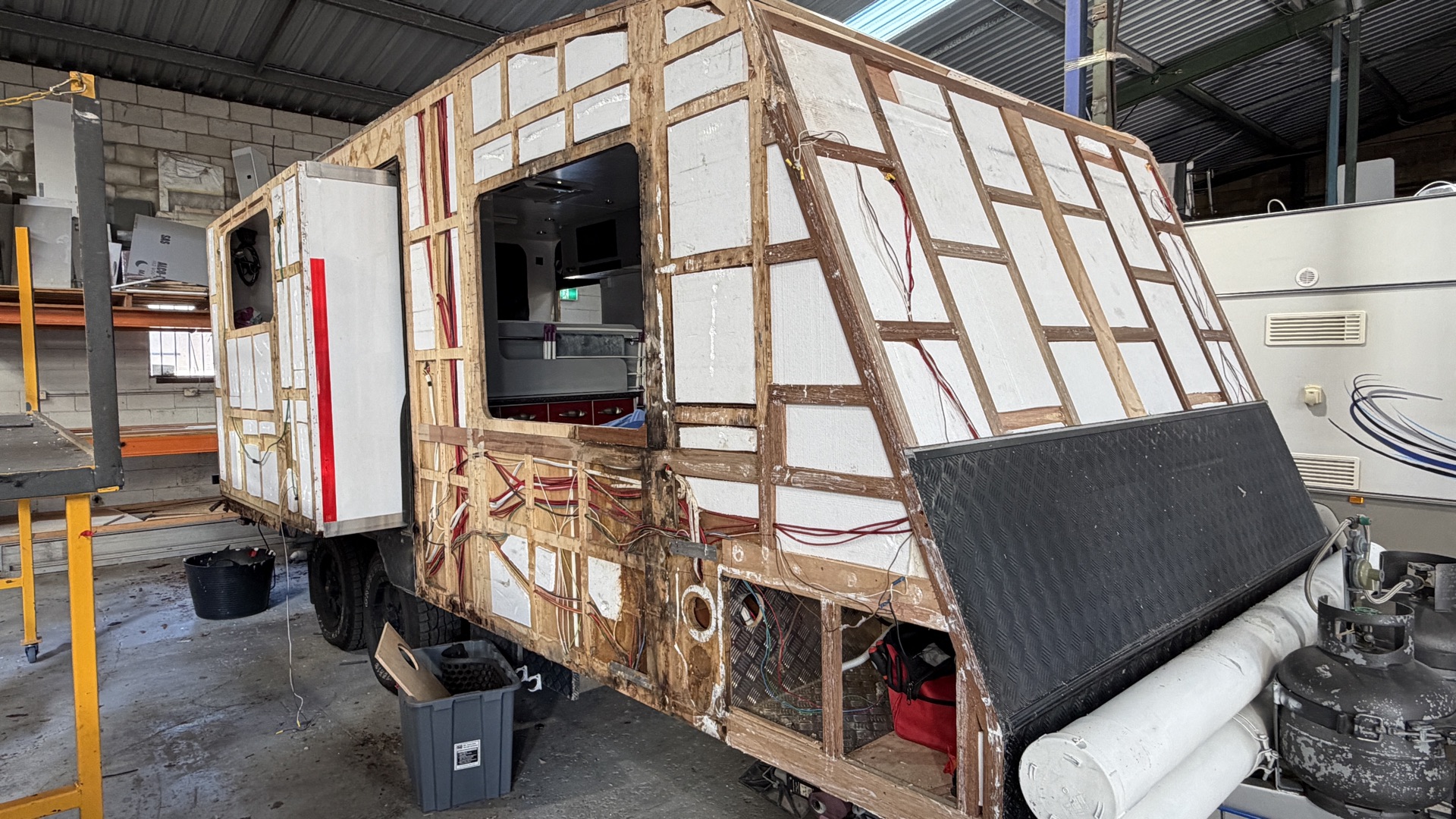 Caravan front and side stripped back for structural repairs