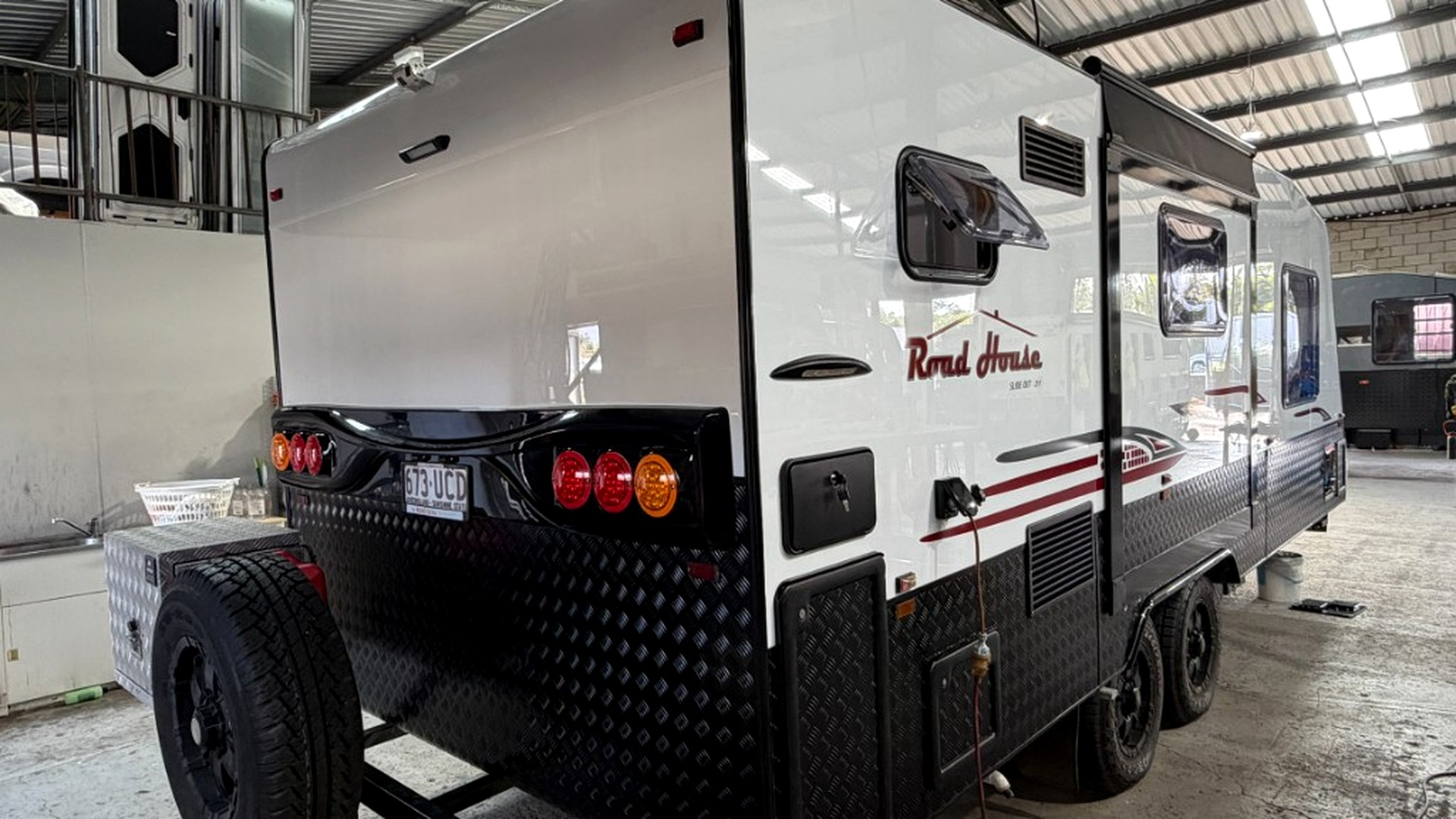 Finished caravan rear view in workshop after exterior rebuild